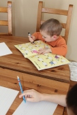 Oliver drawing on the book..and himself